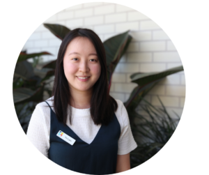 Profile photo of a cheerful woman in white and blue shirt