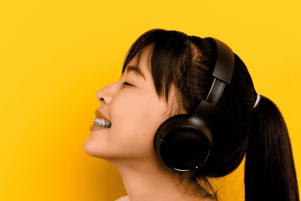woman listening to the music with headphones