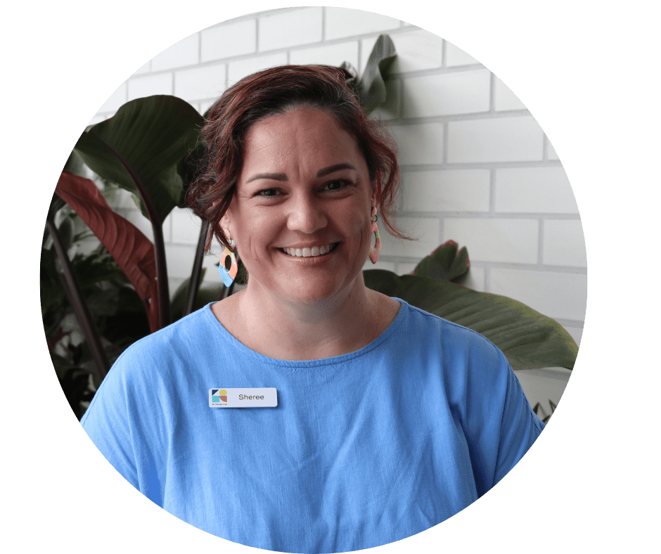 Profile photo of a smiling woman with blue shirt