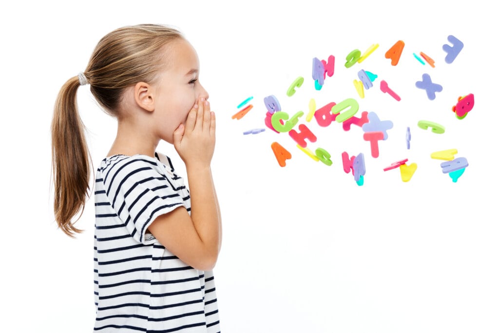 Little girl shouting out letters