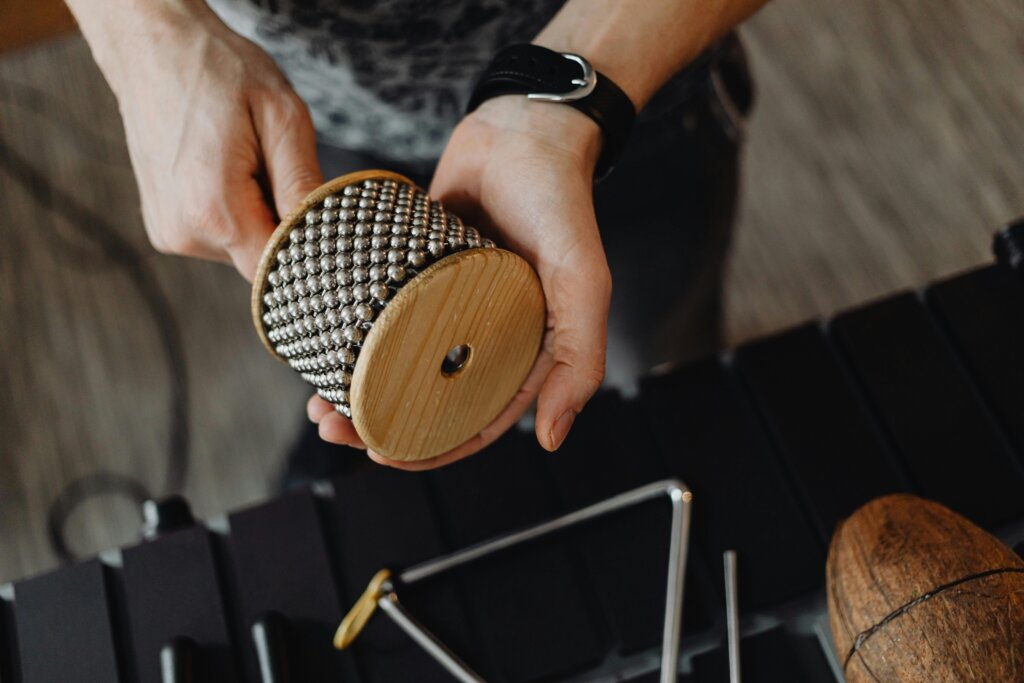 A Man Playing the Cabasa in a music therapy class