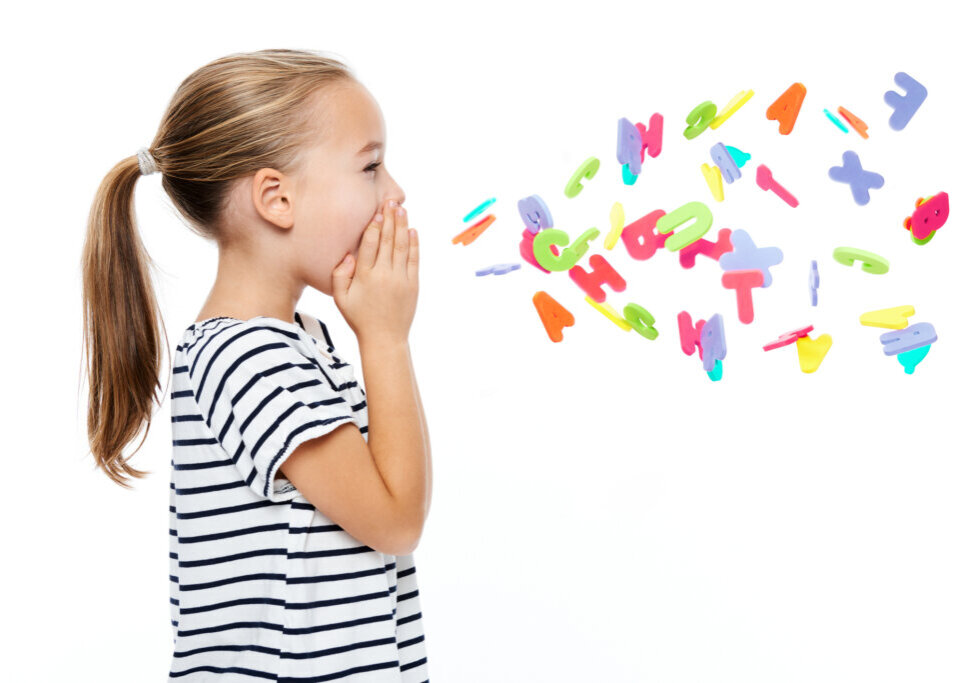 Little girl shouting out letters